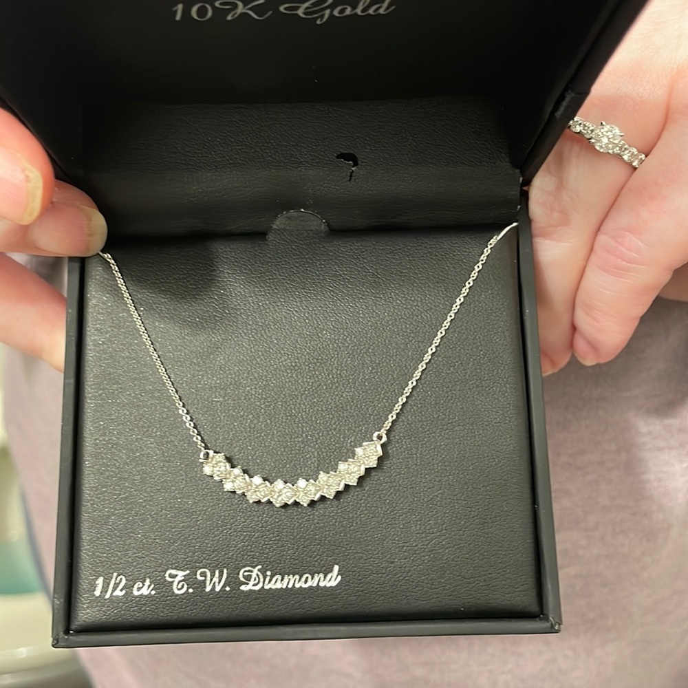 DIAMOND NECKLACE: 1/2 carat diamond, 10k gold.